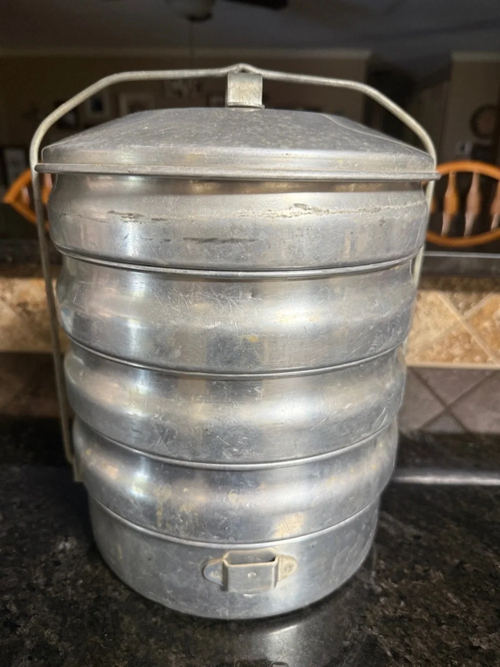 This vintage item is a Regal Aluminum Picnic Carrier.